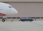 Tesla Model X tows Qantas plane