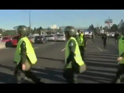 Argentine Policeman jumps on car